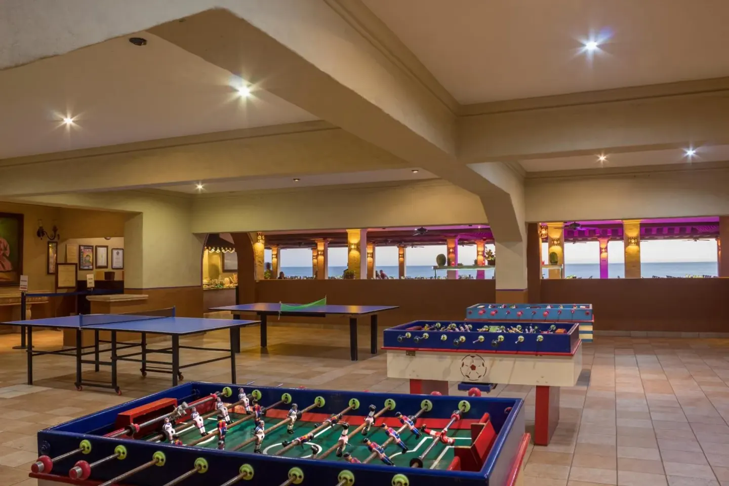 Game room with foosball and ping pong tables at Hotel Playa Mazatlan.