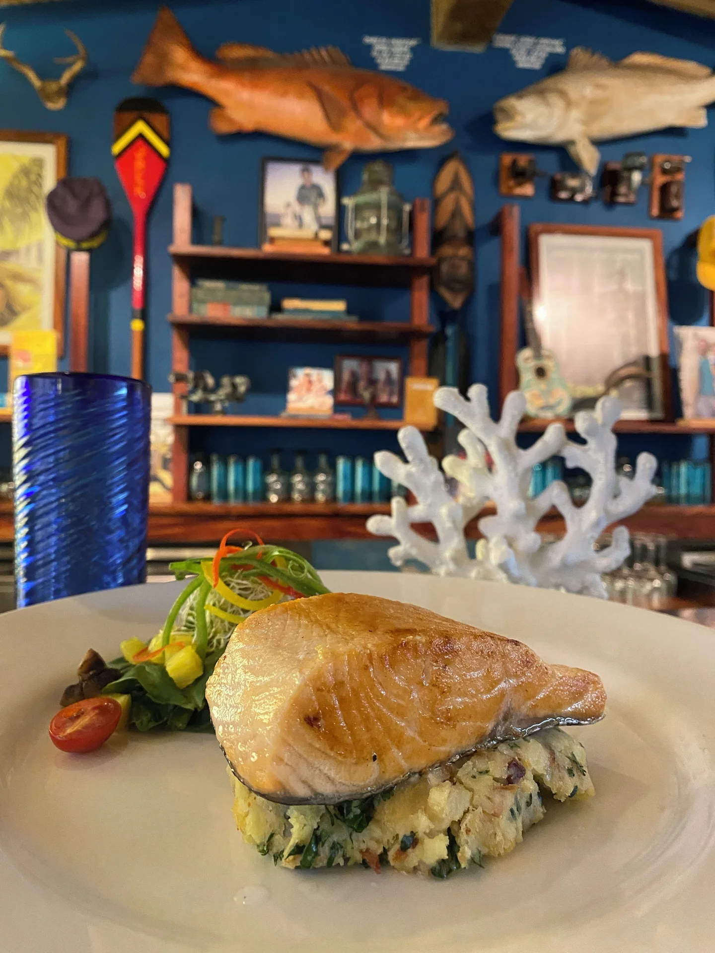Plated salmon dish in a seafood-themed dining room at Hotel Playa Mazatlan.
