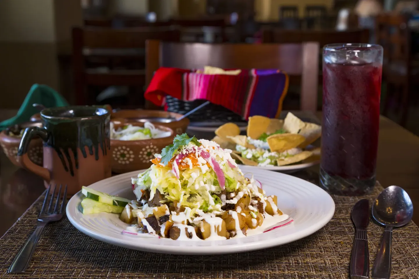 Mexican dish with tortillas and a dark drink at Hotel Playa Mazatlan.