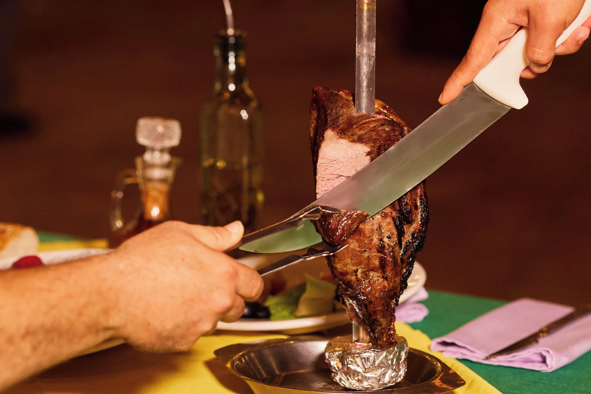 Carved grilled meat on a skewer at a table at Hotel Playa Mazatlan.