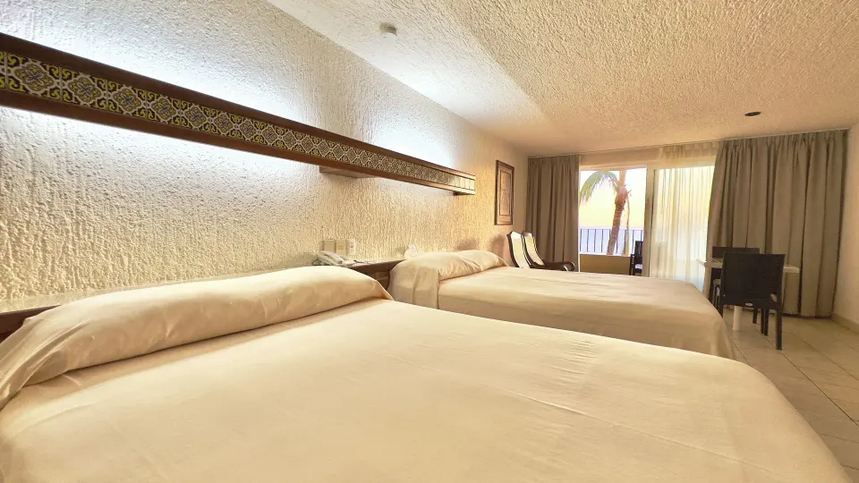 Wide view of a two-bed ocean view room at Hotel Playa Mazatlan.