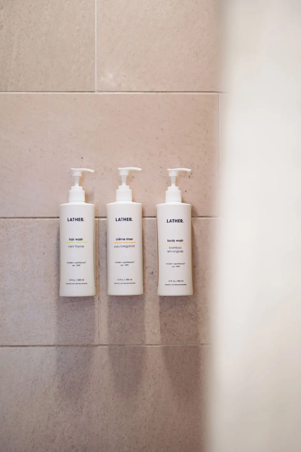 Shower wall amenities in a Standard Full bathroom at Hotel Renew.