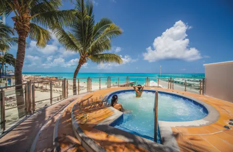 Circular whirlpool terrace overlooking the beach at Hotel Riu Cancun.