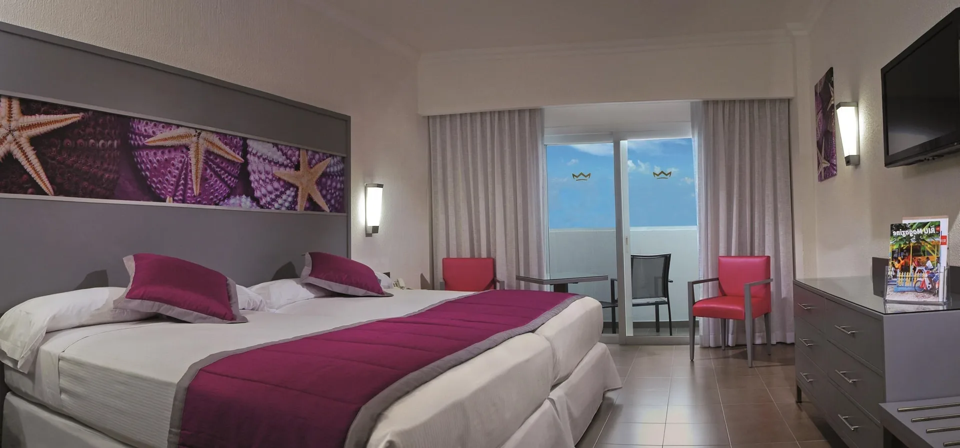 Standard Room Ocean View with twin beds and balcony at Hotel Riu Cancun.
