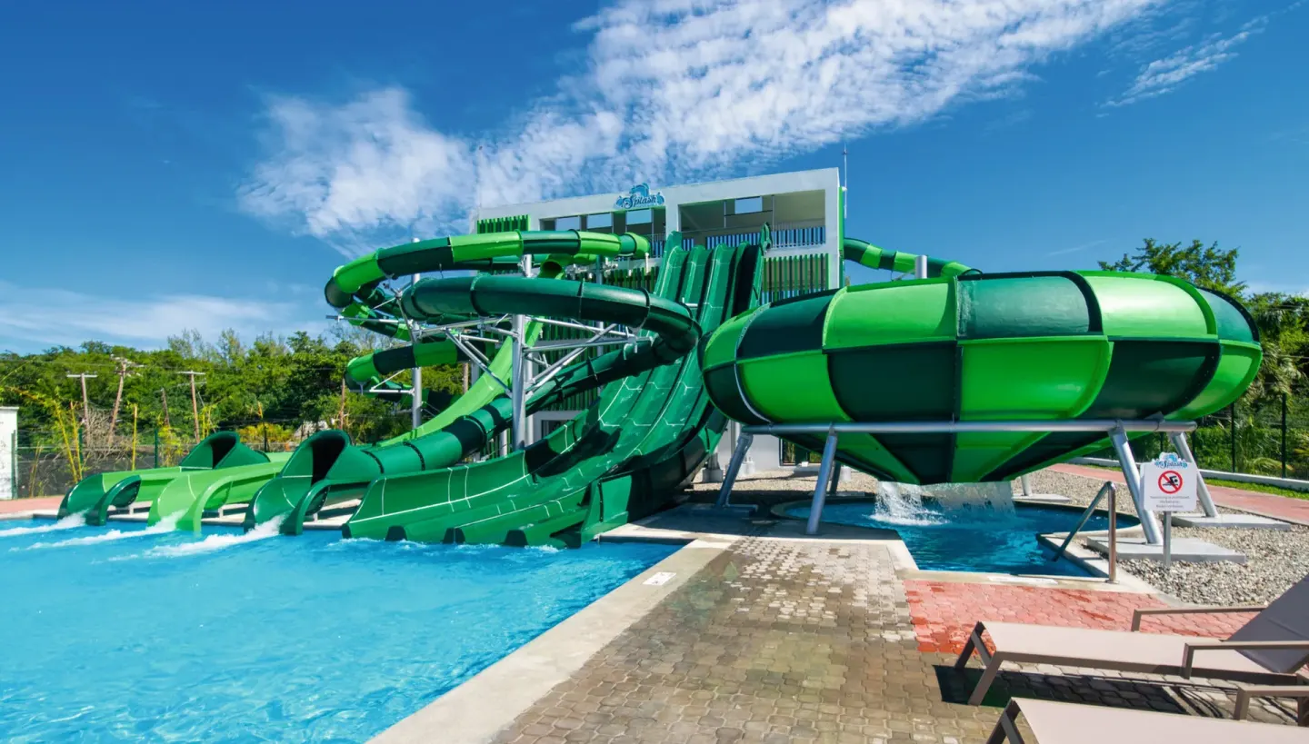 Close view of green water slides and splash pool at Hotel Riu Montego Bay.