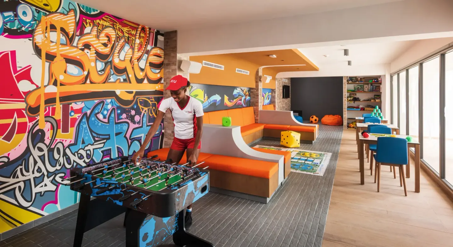 Graffiti-themed game lounge with foosball at Hotel Riu Ocho Rios.