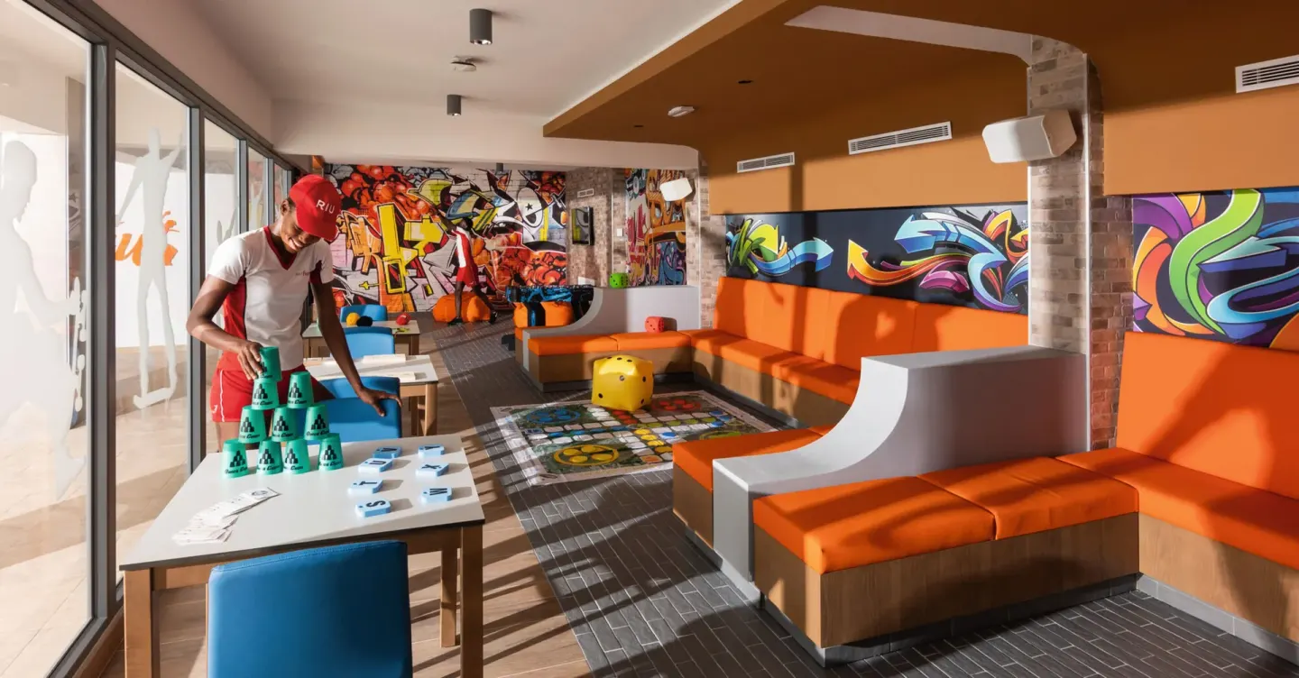 Colorful indoor game lounge with table games at Hotel Riu Ocho Rios.