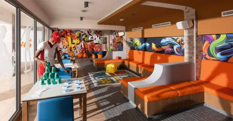 Colorful indoor game lounge with table games at Hotel Riu Ocho Rios.