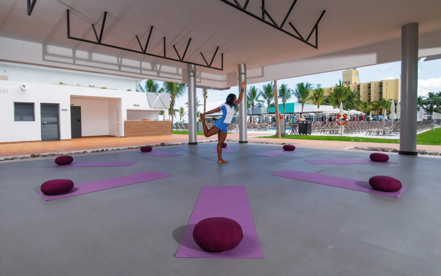Outdoor yoga setup with mats and cushions at Hotel Riu Ocho Rios.