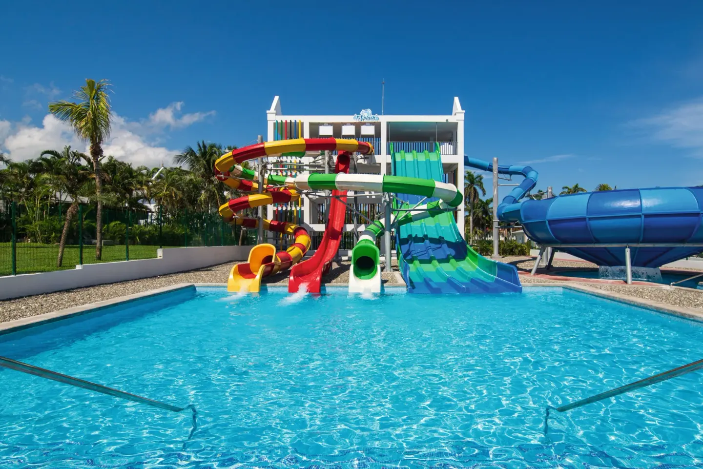 Water park pool with twisting tube slides and racing slides at Hotel Riu Ocho Rios.