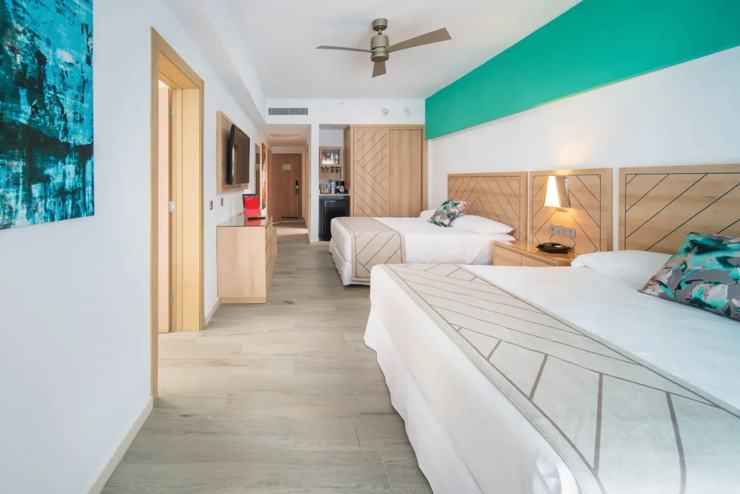 Family Room bedroom with two double beds and entry area at Hotel Riu Ocho Rios.