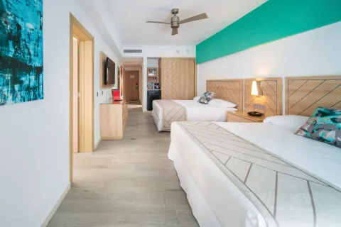 Family Room bedroom with two double beds and entry area at Hotel Riu Ocho Rios.