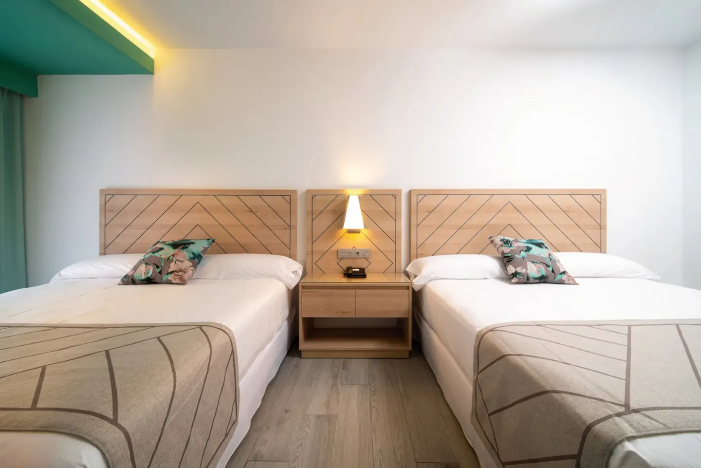 Family Room with two beds and a shared bedside table at Hotel Riu Ocho Rios.