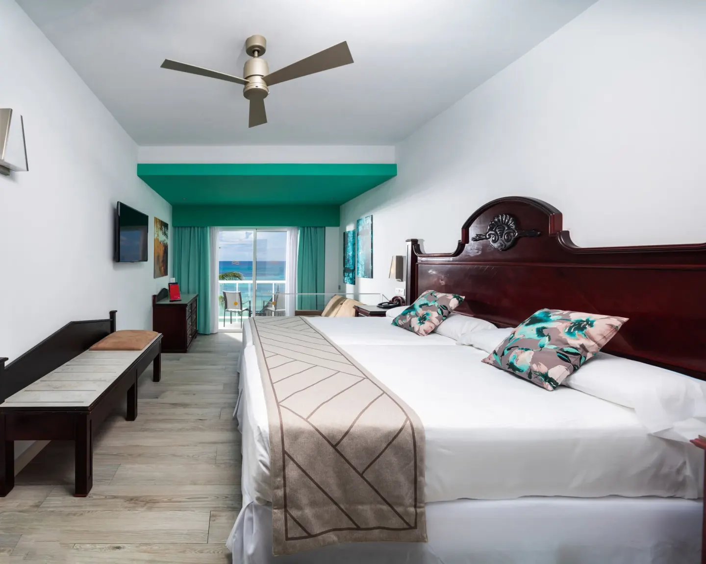 Junior Suite Ocean View bedroom with balcony and sea view at Hotel Riu Ocho Rios.