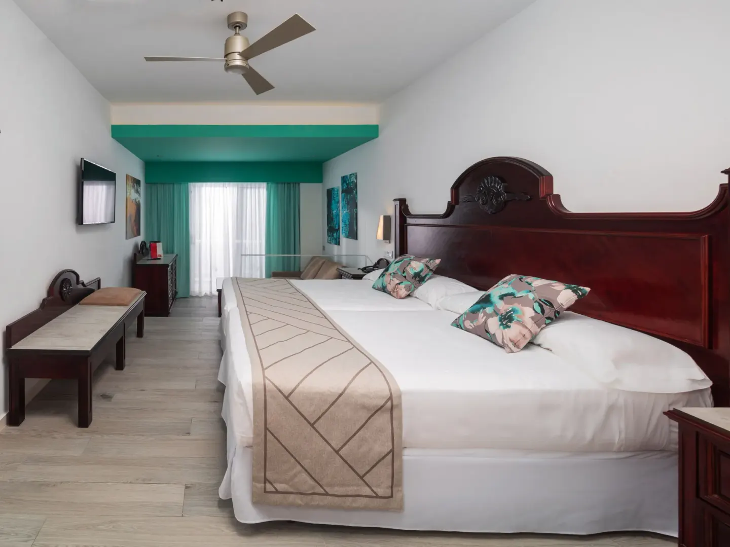 Junior Suite Oceanfront with king bed and balcony doors at Hotel Riu Ocho Rios.