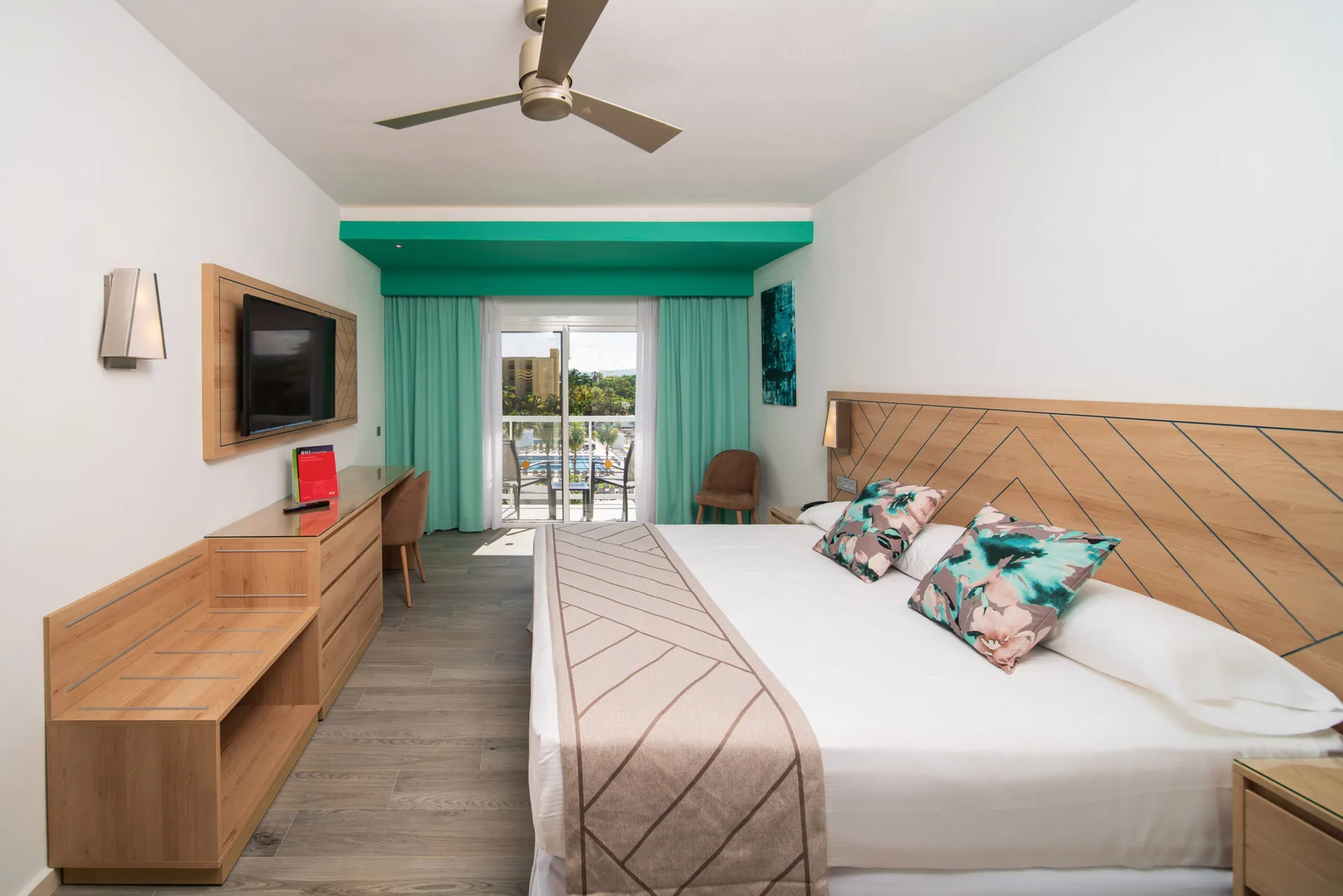 Room Oceanfront at Hotel Riu Ocho Rios with king bed, private balcony, and stunning oceanfront views of the Caribbean in Ocho Rios, Jamaica.