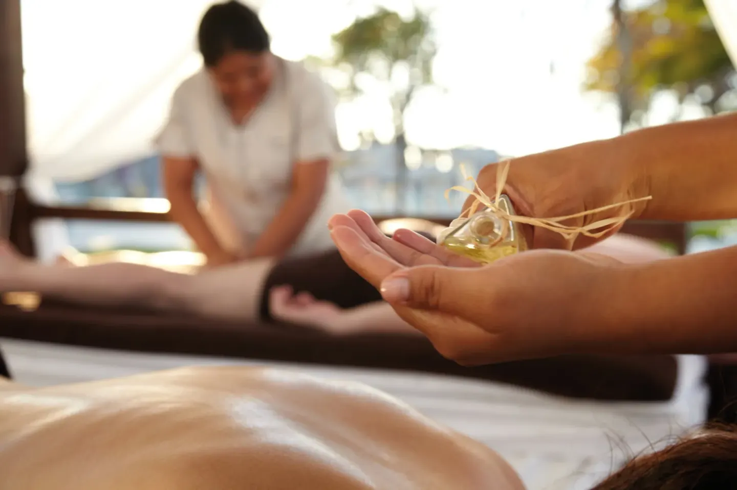Massage treatment with oil being prepared at Hotel Riu Palace Aquarelle.