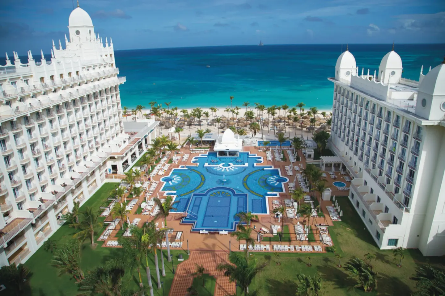 Aerial pool courtyard and beach view at Hotel Riu Palace Aruba.