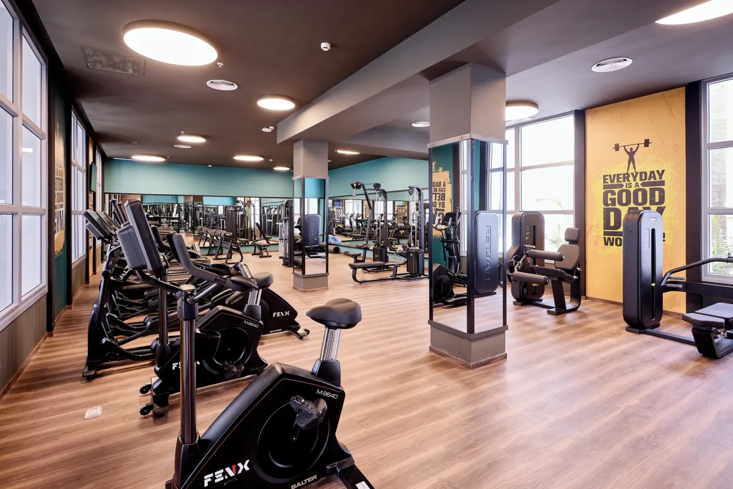 Fitness center with cardio and strength machines at Hotel Riu Palace Bavaro.