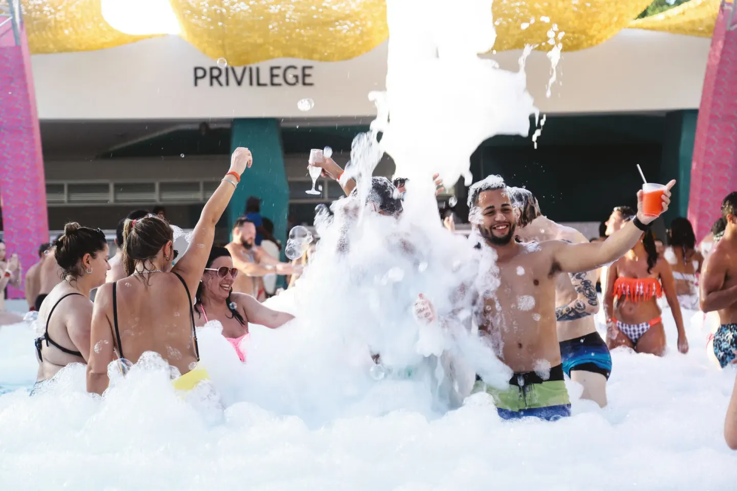 Foam party with guests dancing at Hotel Riu Palace Bavaro.