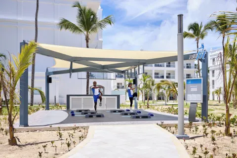 Outdoor fitness class area with shade canopy at Hotel Riu Palace Bavaro.