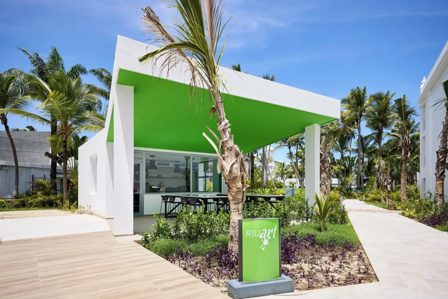 Modern resort activity pavilion with green roof at Hotel Riu Palace Bavaro.
