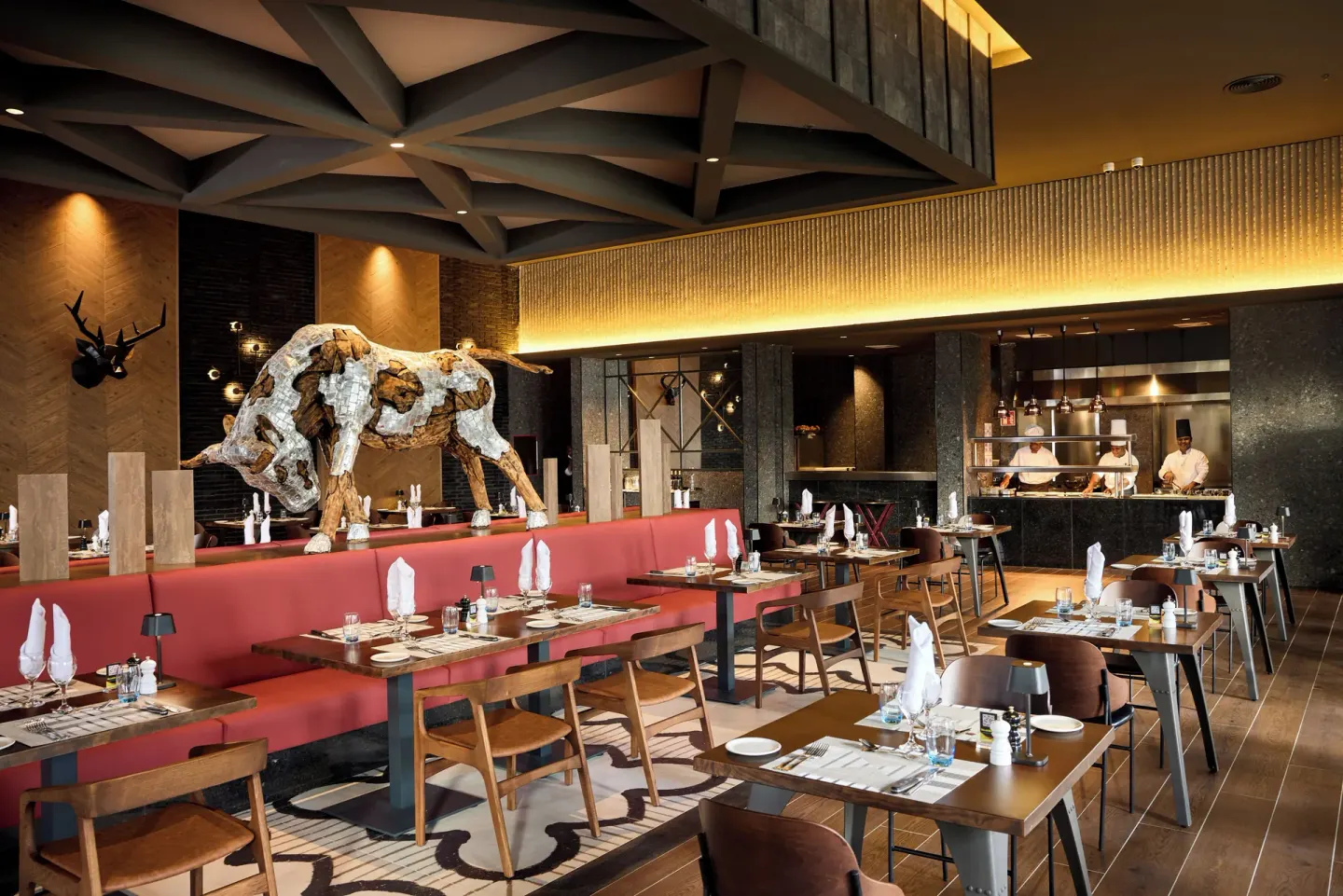 The Steakhouse dining room with bull sculpture at Hotel Riu Palace Bavaro.