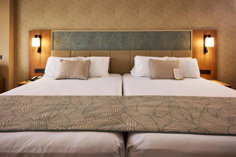 Junior Suite Garden View close-up of two beds at Hotel Riu Palace Bavaro.