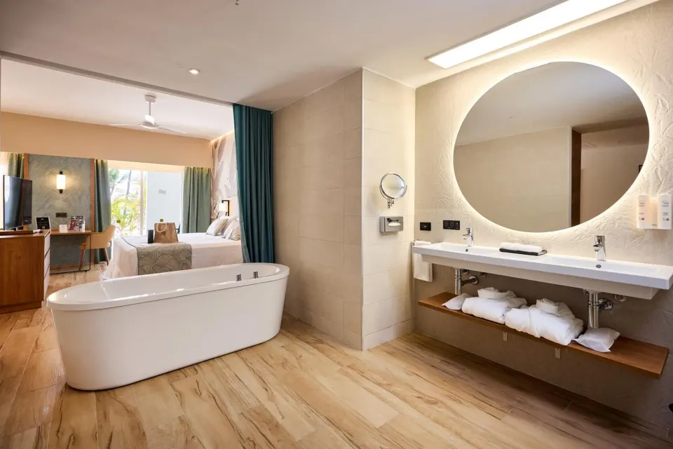 Suite bathroom with freestanding tub and double vanity at Hotel Riu Palace Bavaro.