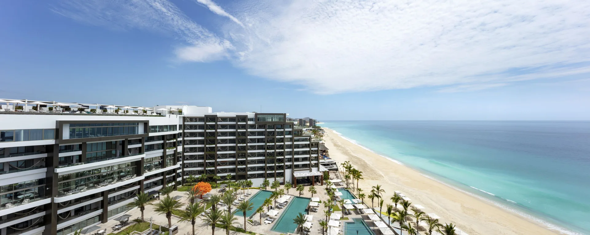 Garza Blanca Los Cabos beachfront resort with modern suites and family-friendly pools
