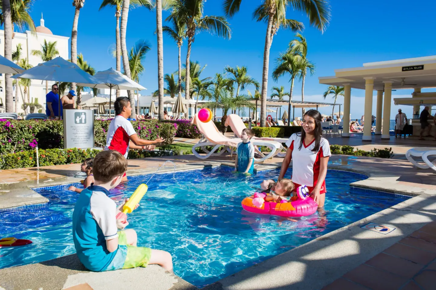 Children playing in a shallow pool at Hotel Riu Palace Cabo San Lucas.