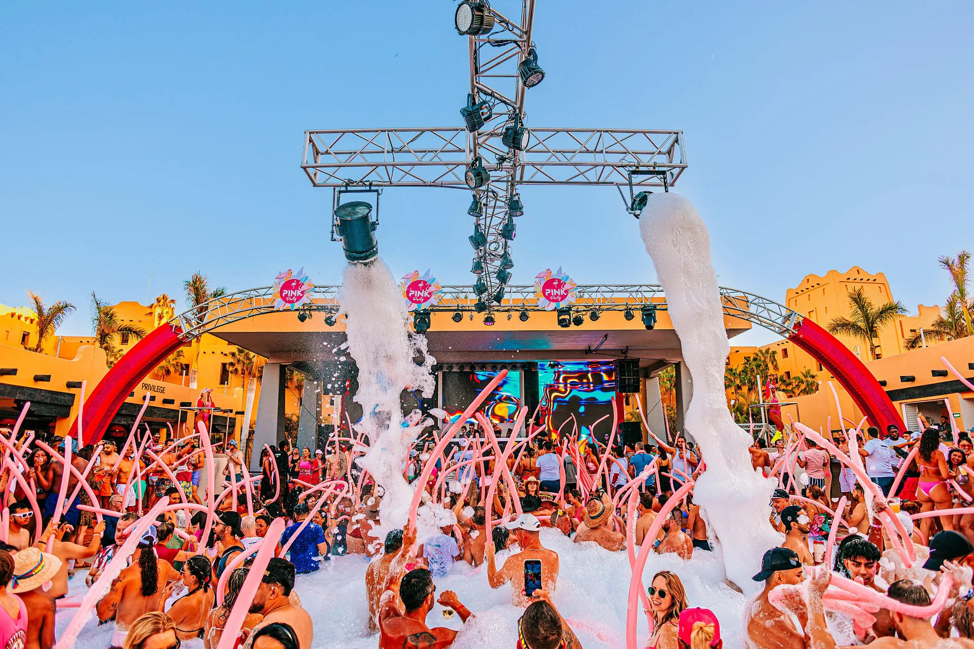 Foam party with stage and crowd at Hotel Riu Palace Cabo San Lucas.