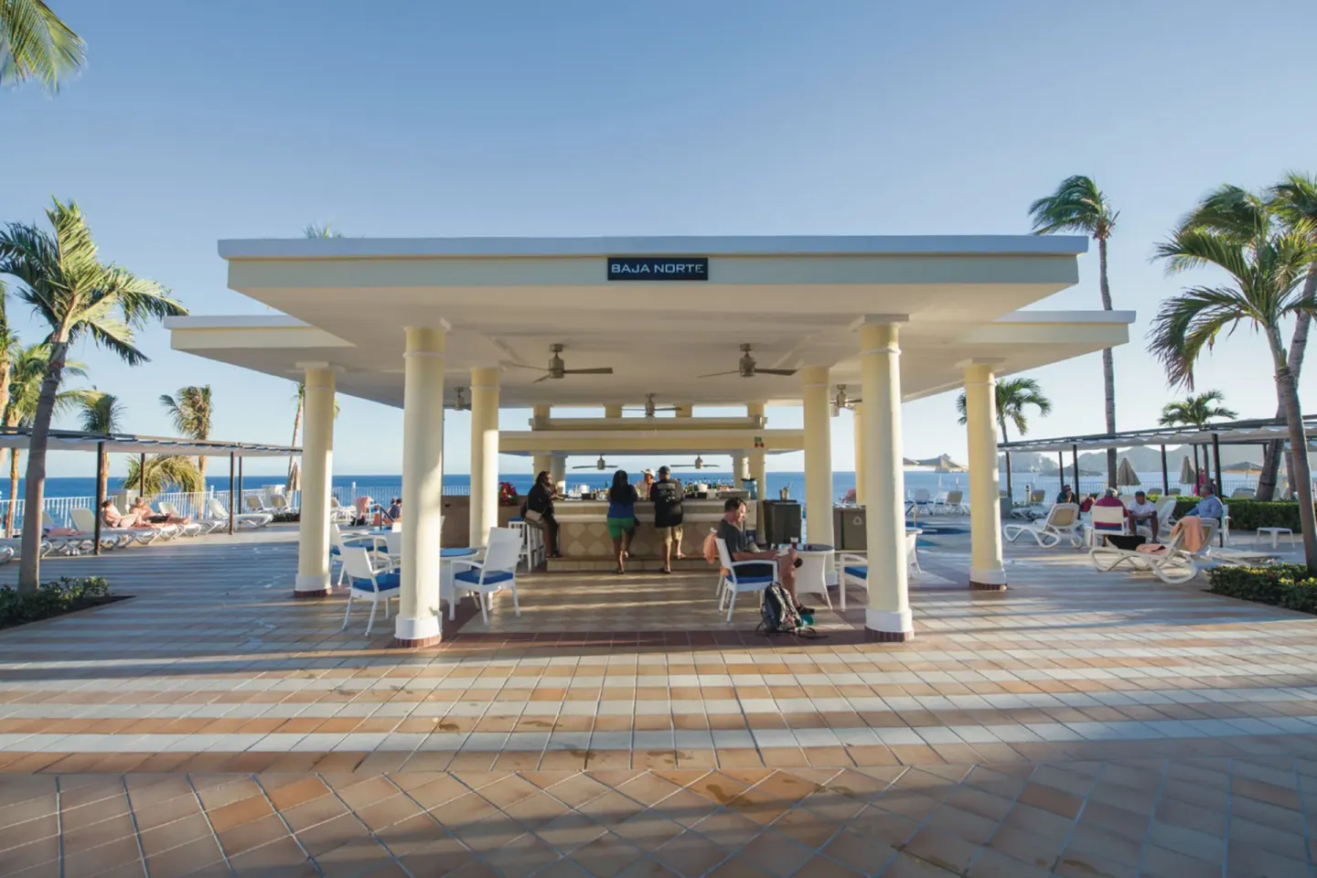 Baja Norte pool bar pavilion facing the ocean at Hotel Riu Palace Cabo San Lucas.
