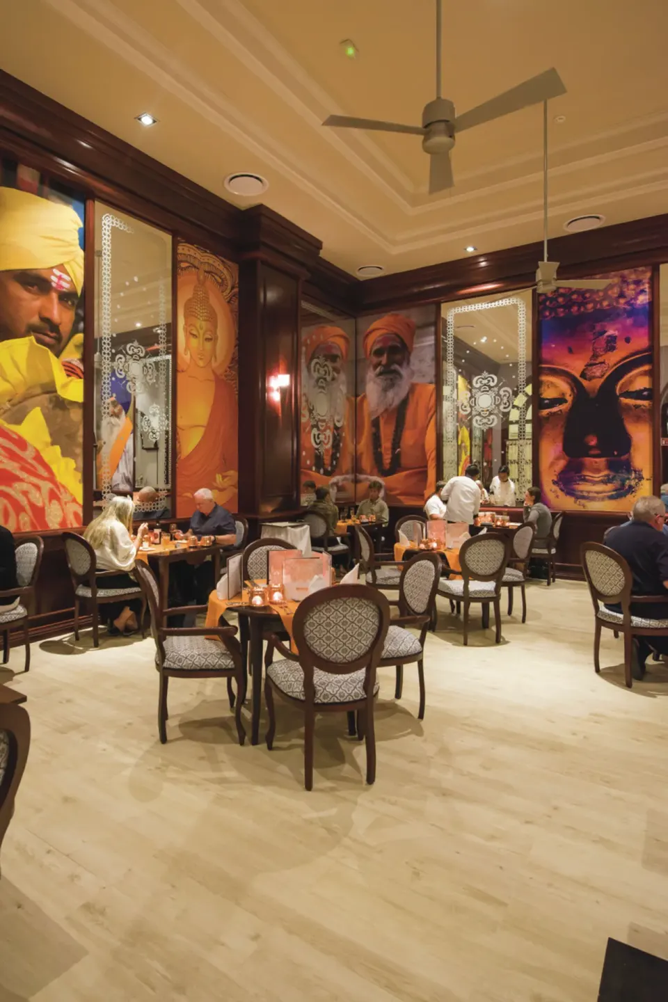 Indian-themed restaurant with large portrait murals at Hotel Riu Palace Cabo San Lucas.