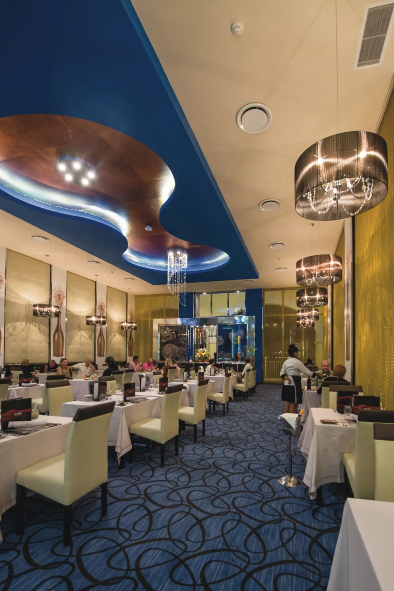 Elegant dining room with blue ceiling details at Hotel Riu Palace Cabo San Lucas.