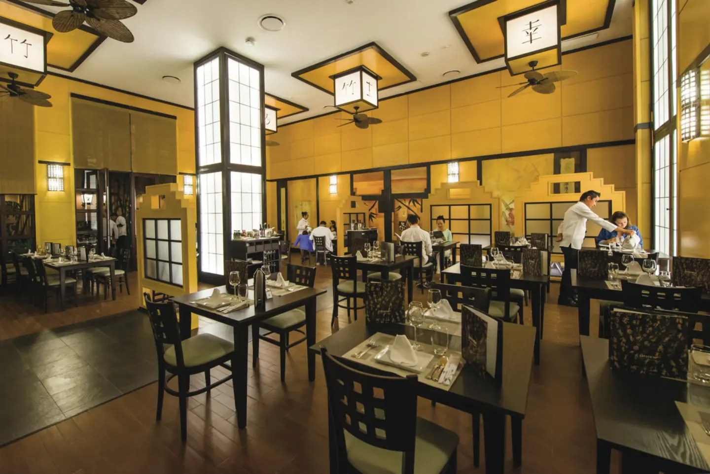 Japanese-style restaurant with lanterns and set tables at Hotel Riu Palace Cabo San Lucas.
