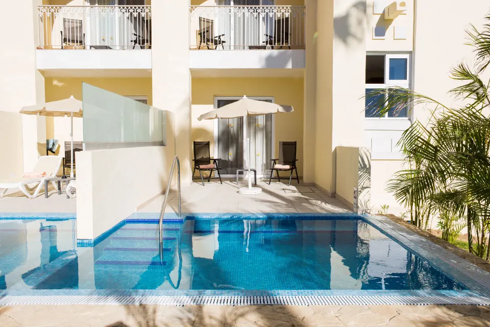 Junior Suite Swim Up terrace with pool access at Hotel Riu Palace Cabo San Lucas.