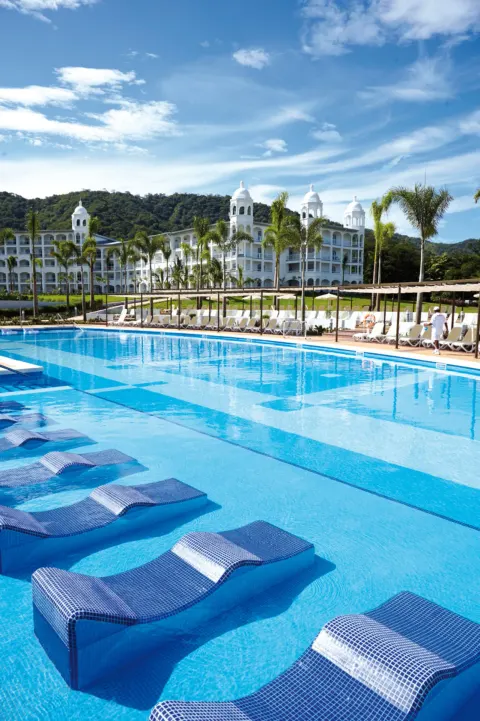 In-water loungers in the main pool at Hotel Riu Palace Costa Rica.