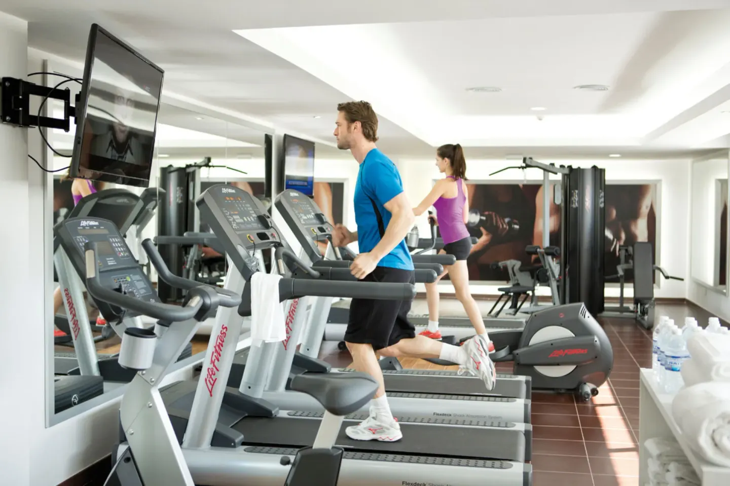 Guests use treadmills in the fitness room at Hotel Riu Palace Jamaica.