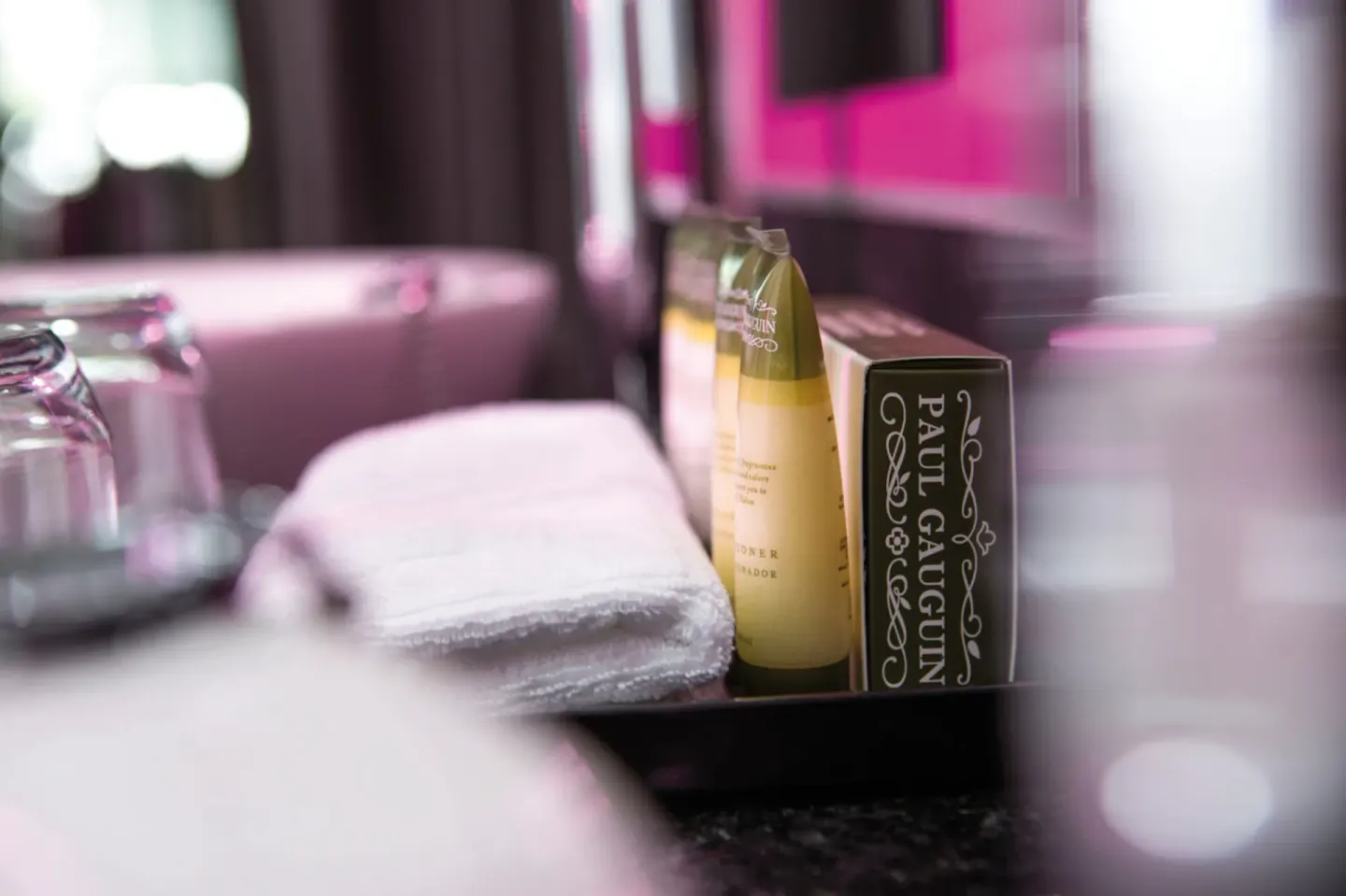 Junior Suite Garden View toiletries and towel on the vanity at Hotel Riu Palace Jamaica.