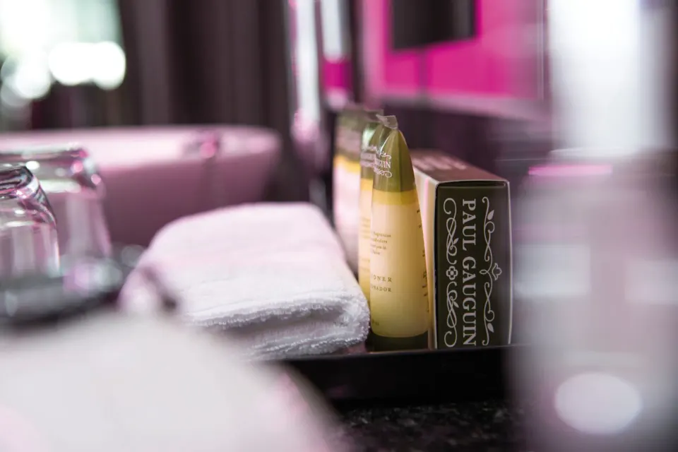 Junior Suite Garden View toiletries and towel on the vanity at Hotel Riu Palace Jamaica.