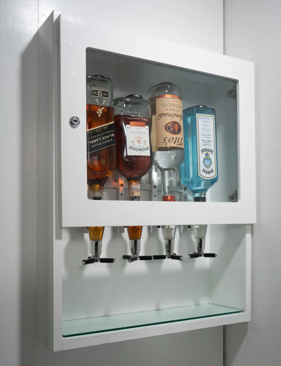 In-room wall-mounted drink dispensers in a suite at Hotel Riu Palace Jamaica.