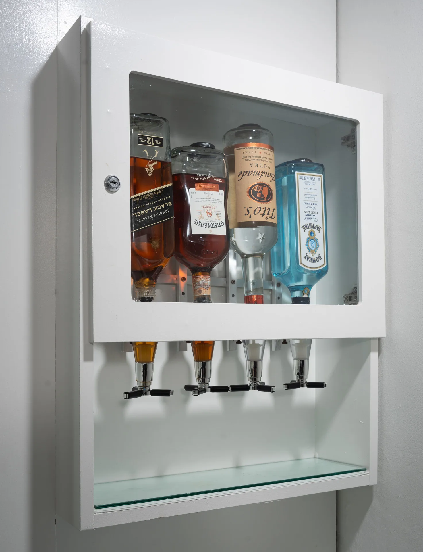 In-room wall-mounted drink dispensers in a suite at Hotel Riu Palace Jamaica.