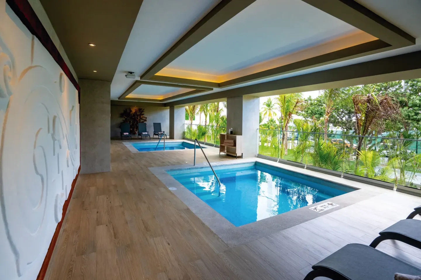 Spa terrace pools overlooking tropical greenery at Hotel Riu Palace Kukulkan.
