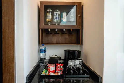 Elite Club Junior Suite Ocean Front minibar station at Hotel Riu Palace Kukulkan.