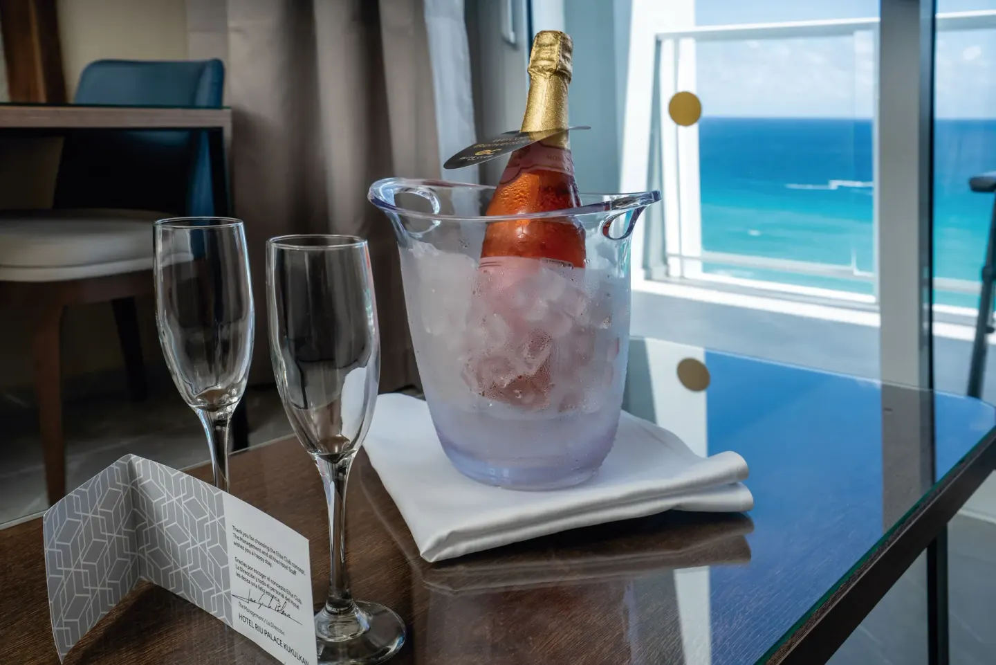 Welcome sparkling wine and ocean view in a Junior Suite at Hotel Riu Palace Kukulkan.