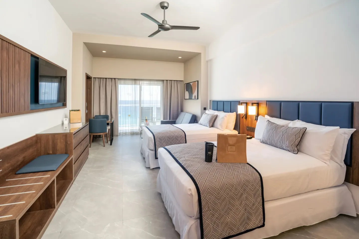 Junior Suite Ocean View Elite Club room with two beds and balcony at Hotel Riu Palace Kukulkan.