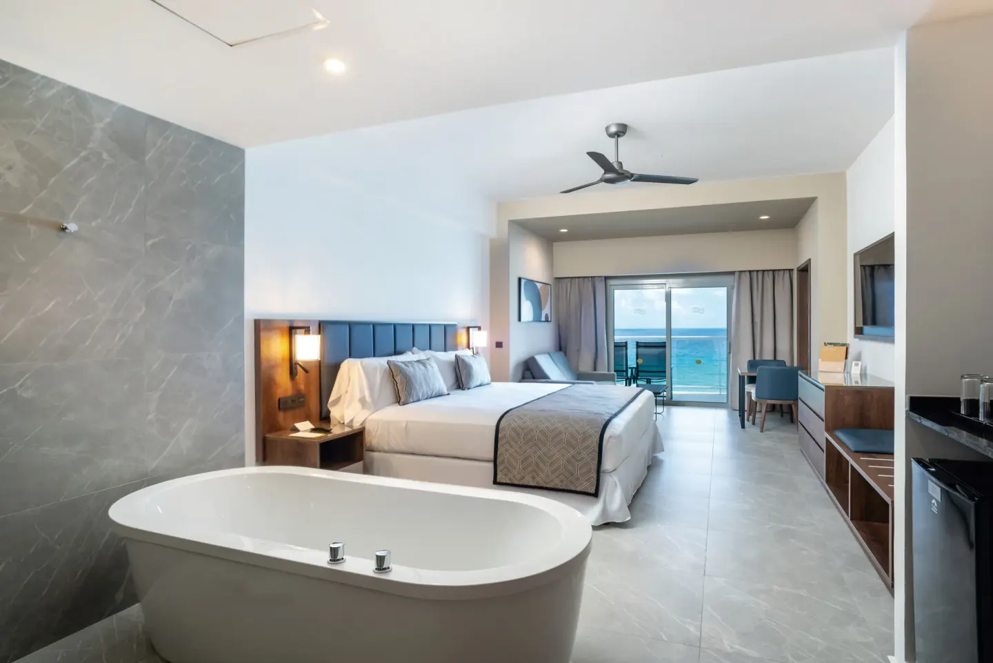 Junior Suite Ocean View with king bed and soaking tub at Hotel Riu Palace Kukulkan.