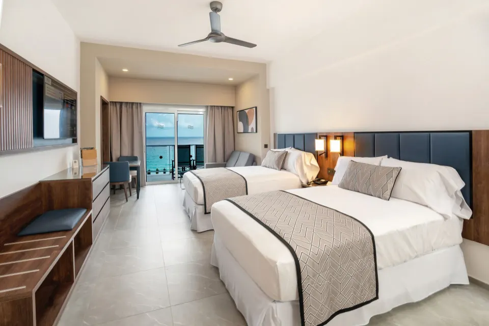 Junior Suite Ocean View with two beds and balcony at Hotel Riu Palace Kukulkan.