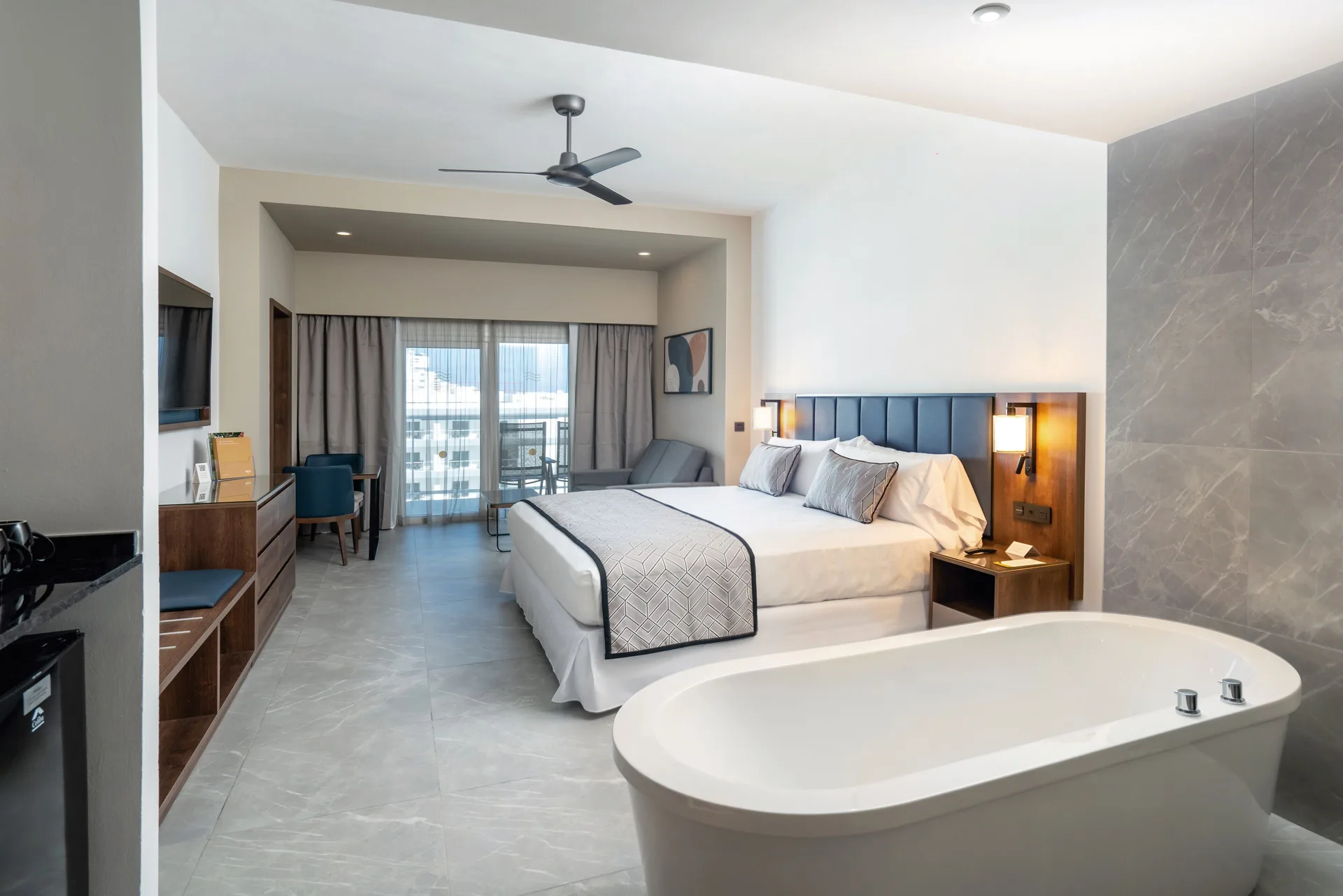 Junior Suite with king bed and soaking tub at Hotel Riu Palace Kukulkan.